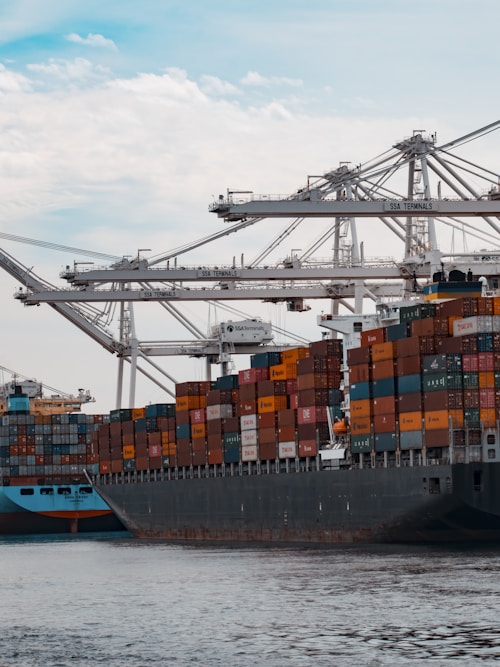 Stacked shipping containers, landed cost optimization